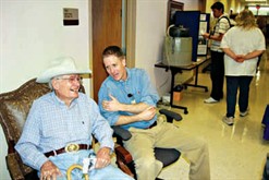 Wilson Moon, 98, of Holland, left, visits with agricultural engineer Daren Harmel during the Blackland Center’s 100th anniversary celebration Monday. Nearly 100 guests toured the facility to see research exhibits and visit with resident scientists.