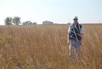 Engineer and site manager Daren Harmel in a native hay field at the USDA-ARS Riesel Watersheds.