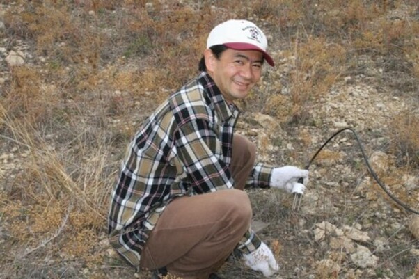 Dr. Yasushi MORI making soil moisture measurements in Texas