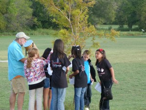 Central Texas Master Naturalist, Tom Olsen, has Belton ISD’s Tyler Elementary fourth grade students using thier senses (looking, feeling, and smelling) to investigate a bald cypress tree.  Photo by Jerry Lewis