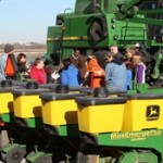 Dr. Rick Haney shows a group of fifth graders the equipment used in agricultural research.